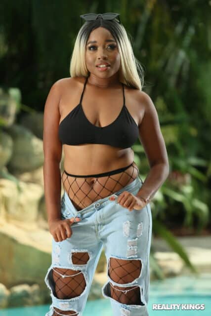 Nina Rivera XXXBios - Hot curvy and thick all natural black pornstar Nina Rivera shows off her natural big boobs and big ass bubble butt booty in sexy cropped black sweater, ripped denim jeans, black bra and panties with black high heels - Reality Kings Nina Rivera porn pics sfw
