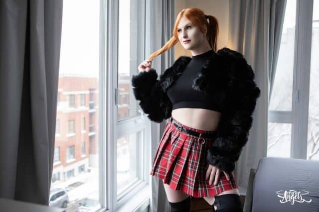 Evie Envy XXXBios - Hottest tall redhead thick and curvy TS Canadian pornstar Evie Envy shows off her big tits and big ass bubble butt booty in sexy cropped black sweater top, red tartan skirt, black panties and black knee high socks stockings with her hair in pigtails - Trans Angels Evie Envy porn pics sfw