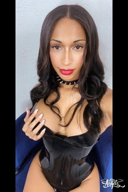 Jasmine Lotus XXXBios - Hottest tall busty brunette black TS pornstar Jasmine Lotus shows off her 36D big tits and big ass bubble butt booty in sexy black choker and black corset with black panties and high heels - Trans Angels Jasmine Lotus porn pics sfw