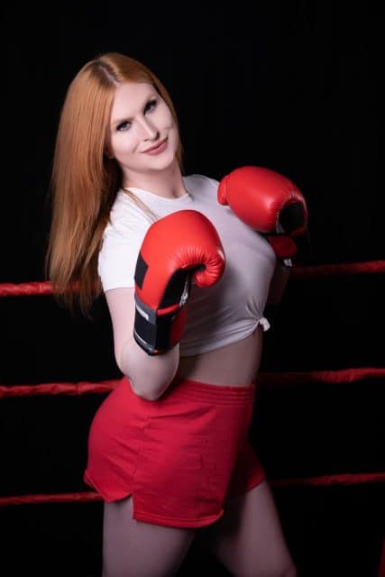 Evie Envy XXXBios - Hottest tall redhead thick and curvy TS Canadian pornstar Evie Envy shows off her big tits and big ass bubble butt booty in sexy cropped white tshirt, red booty shorts, red boxing gloves and sneakers - What A Knockout Trans Angels Evie Envy porn pics sfw